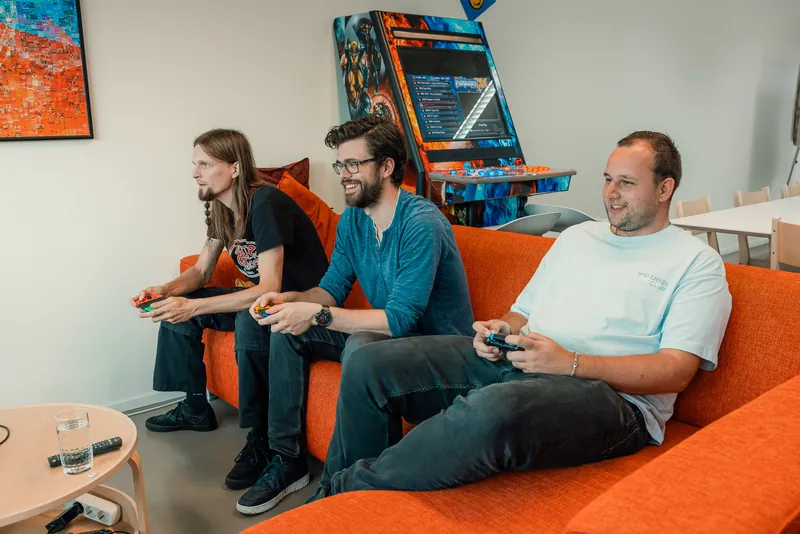 The orange couch belongs to everyone