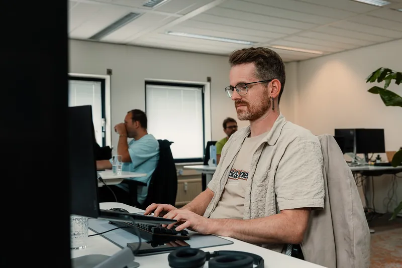 A colleague at work in the Groningen office