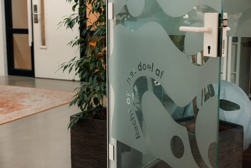 The glass door to the meeting room